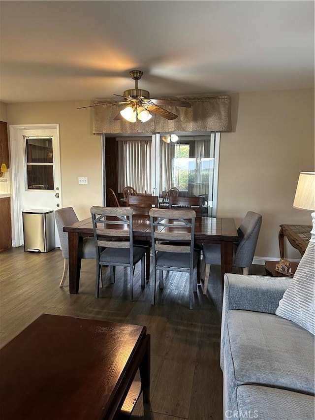 dining area with ceiling fan and hardwood / wood-style floors