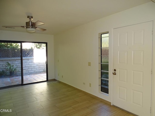 spare room featuring ceiling fan and light hardwood / wood-style floors