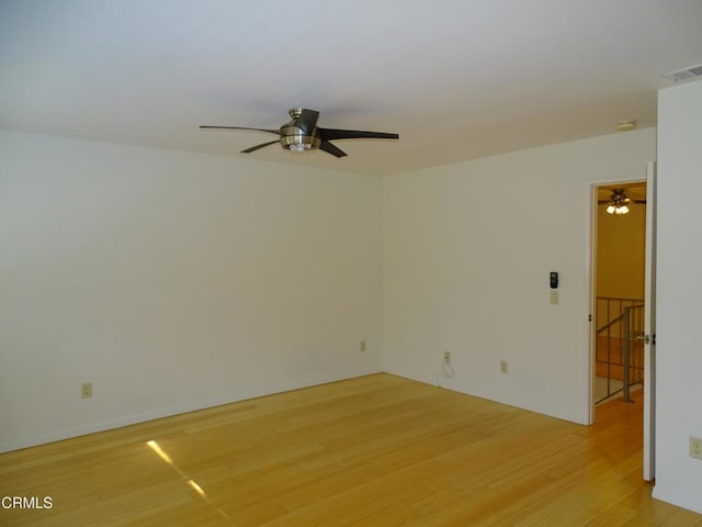 unfurnished room featuring ceiling fan and light hardwood / wood-style flooring