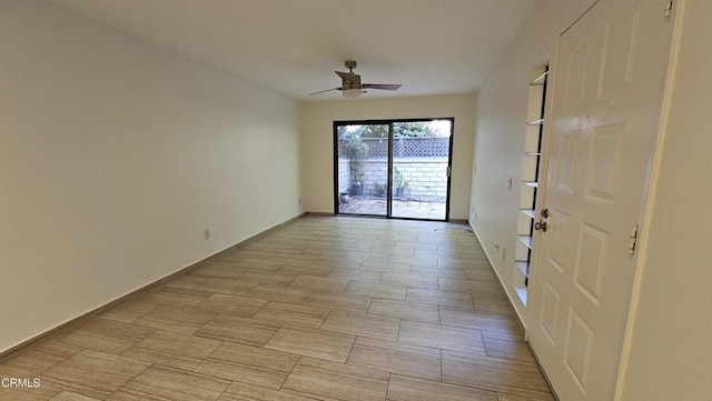 unfurnished room with ceiling fan