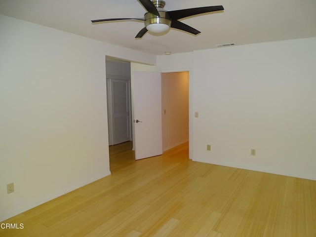 unfurnished room featuring ceiling fan and light wood-type flooring