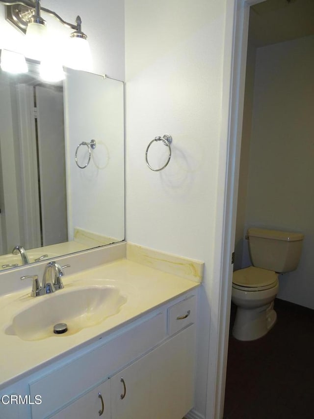 bathroom with vanity and toilet