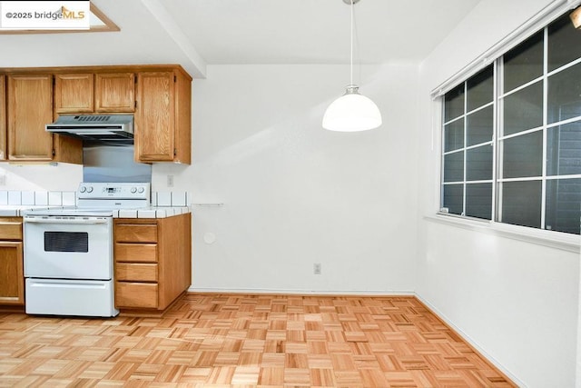 kitchen with decorative light fixtures, tile counters, and white range with electric stovetop