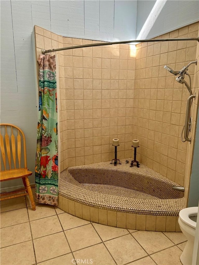 bathroom with tile patterned flooring, toilet, and walk in shower