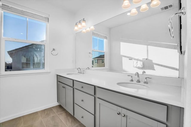 bathroom with vanity and tile patterned flooring