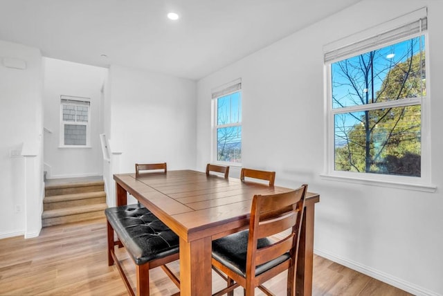 dining space with light wood-type flooring