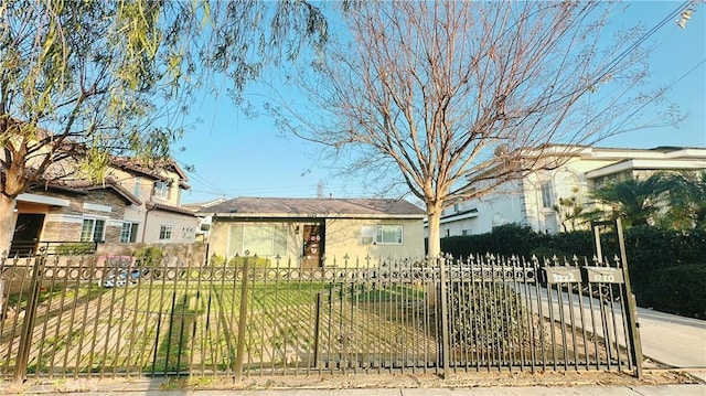 ranch-style house with a front lawn