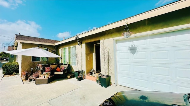 rear view of house featuring a garage