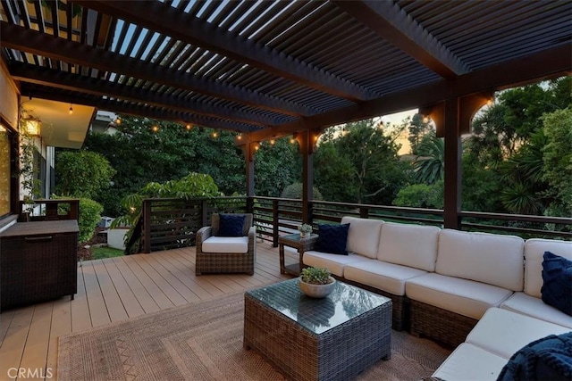 wooden terrace with a pergola and outdoor lounge area