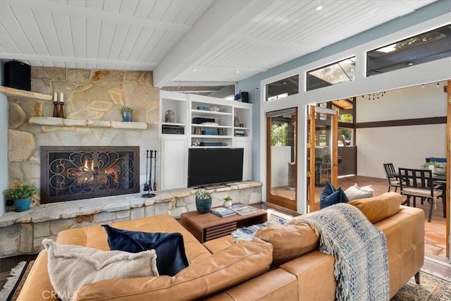 living room featuring beamed ceiling, wood ceiling, a fireplace, and hardwood / wood-style flooring