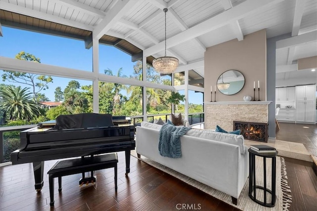 interior space featuring high vaulted ceiling, dark hardwood / wood-style floors, and beam ceiling