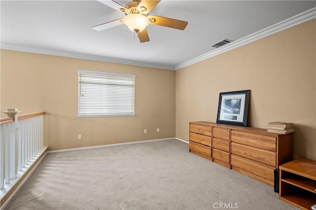 carpeted bedroom with ornamental molding and ceiling fan