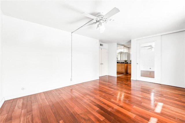 unfurnished living room featuring hardwood / wood-style floors and ceiling fan