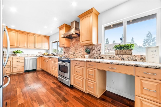 kitchen featuring dark wood-type flooring, stainless steel appliances, light stone countertops, light brown cabinetry, and exhaust hood