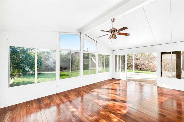 unfurnished sunroom featuring plenty of natural light, vaulted ceiling with beams, and ceiling fan