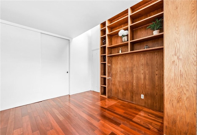 empty room with hardwood / wood-style flooring