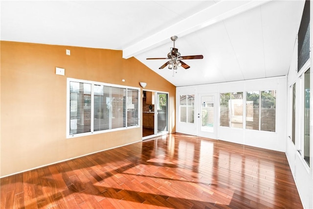 unfurnished sunroom with vaulted ceiling with beams and ceiling fan