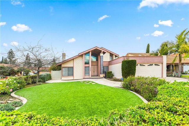 view of front of house featuring a garage and a front yard