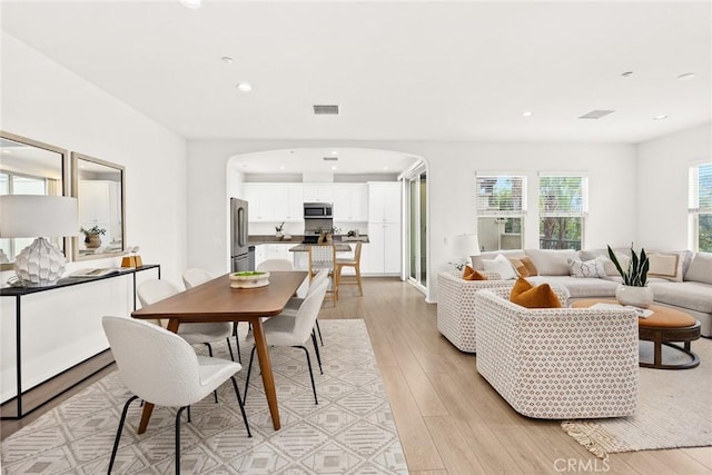 dining space featuring light hardwood / wood-style floors