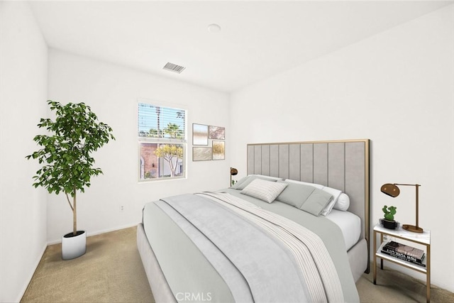 bedroom featuring light colored carpet