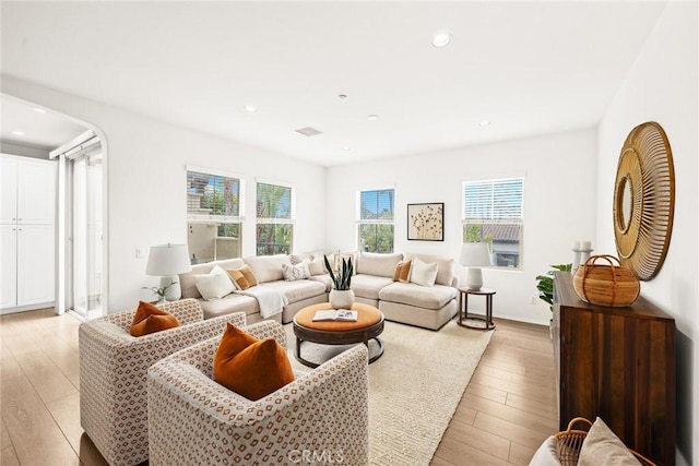 living room with light hardwood / wood-style flooring