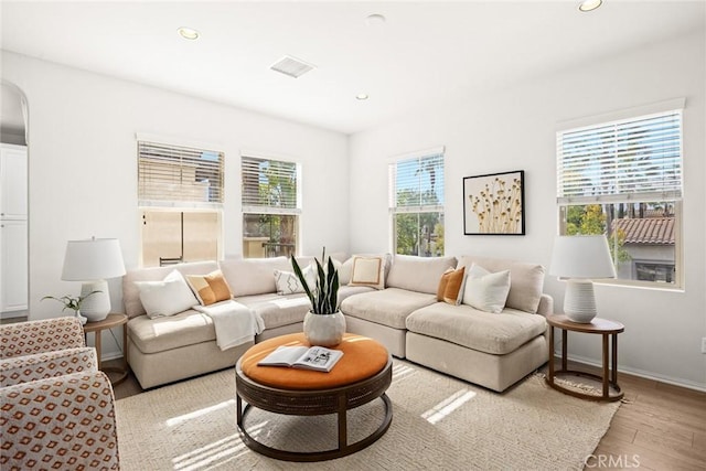 living room with light hardwood / wood-style floors