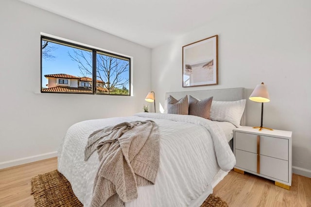 bedroom with light hardwood / wood-style floors