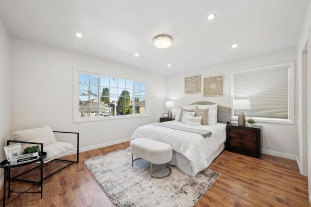 bedroom with hardwood / wood-style flooring