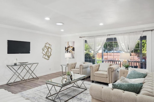 living room featuring hardwood / wood-style floors, plenty of natural light, and ornamental molding