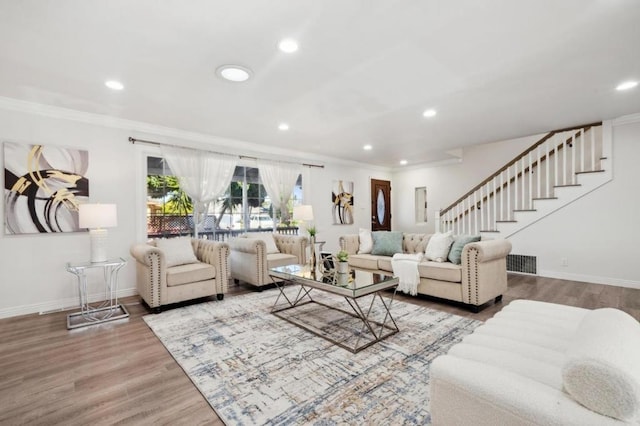 living room with crown molding and wood-type flooring