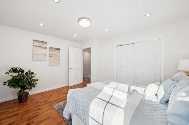 bedroom featuring hardwood / wood-style flooring and a closet