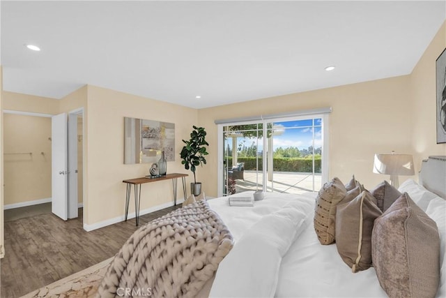 bedroom with hardwood / wood-style flooring and access to exterior