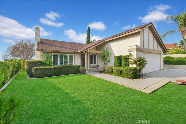 ranch-style house featuring a garage and a front yard