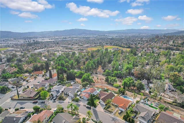 drone / aerial view featuring a mountain view