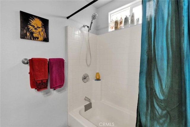 bathroom with shower / bath combination with curtain