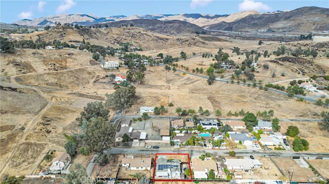 birds eye view of property featuring a mountain view