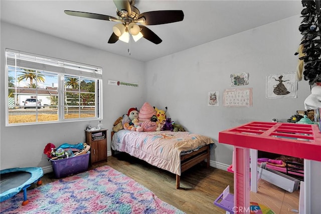 bedroom with hardwood / wood-style flooring and ceiling fan