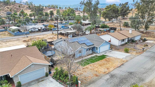 birds eye view of property featuring a mountain view