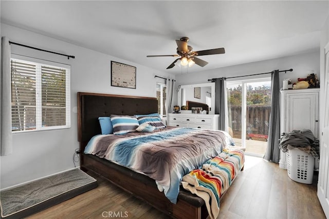 bedroom with hardwood / wood-style flooring, ceiling fan, and access to exterior