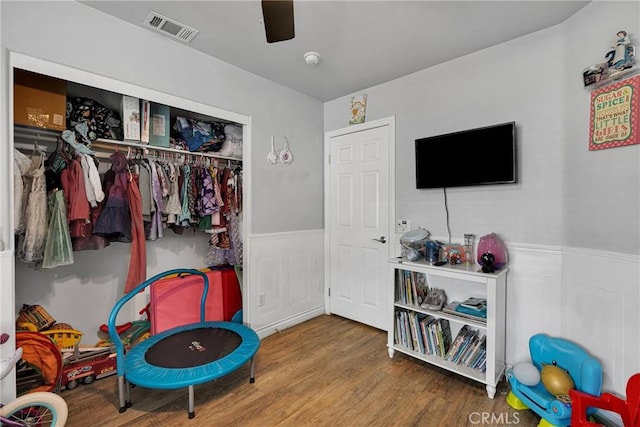 rec room featuring hardwood / wood-style floors and ceiling fan