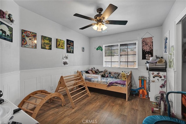 bedroom featuring wood-type flooring and ceiling fan