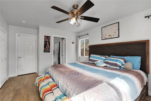 bedroom featuring hardwood / wood-style flooring and ceiling fan