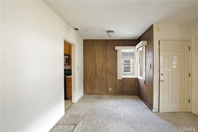 interior space featuring wood walls