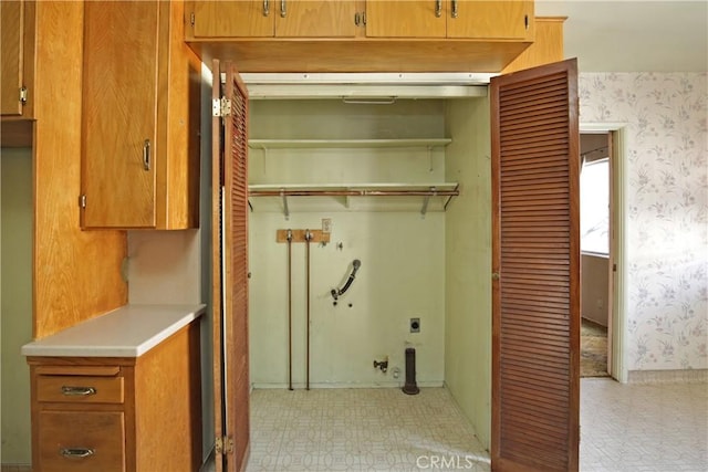 washroom with cabinets and hookup for an electric dryer