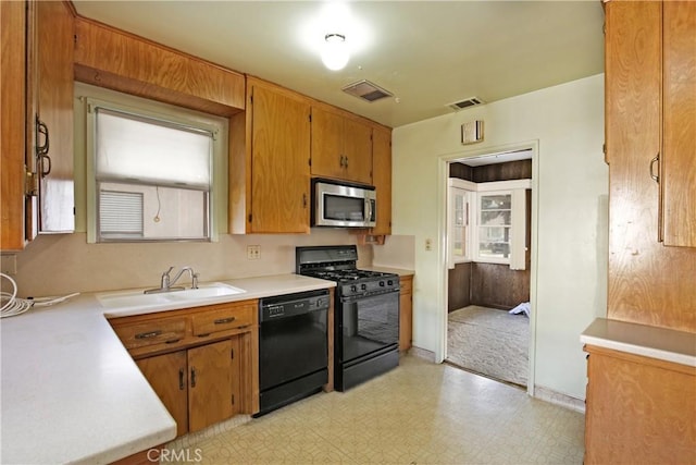 kitchen with sink and black appliances