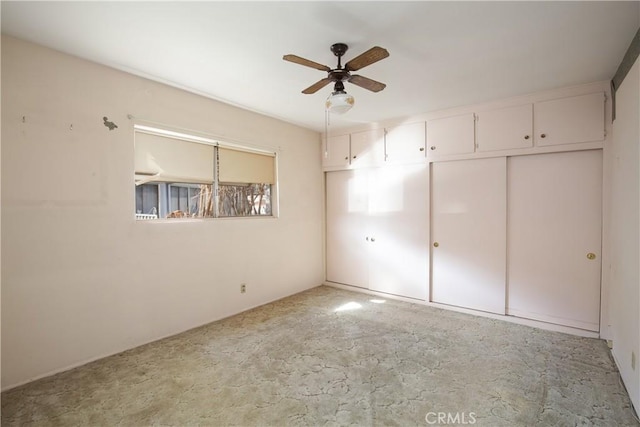 unfurnished bedroom with a closet and ceiling fan