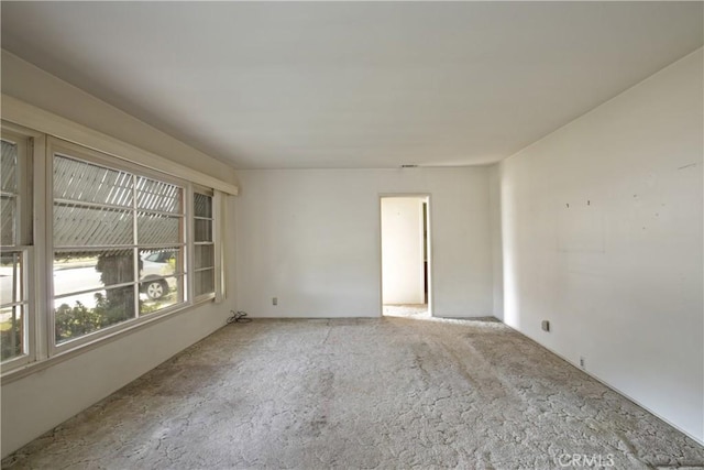 spare room with light colored carpet