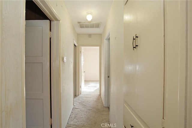 hallway with light carpet