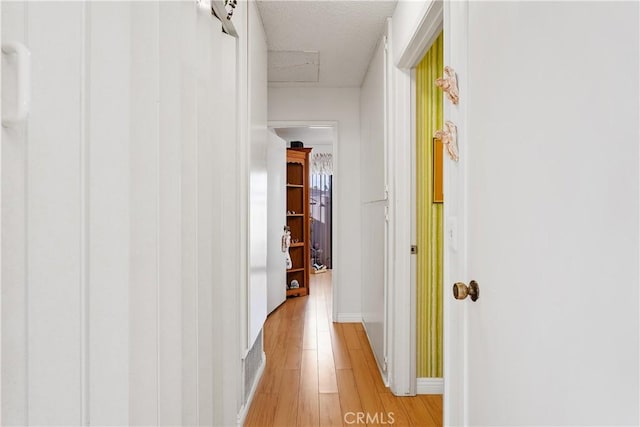 hall featuring light hardwood / wood-style floors