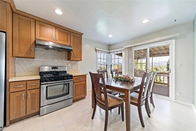 kitchen featuring backsplash and stainless steel gas stove